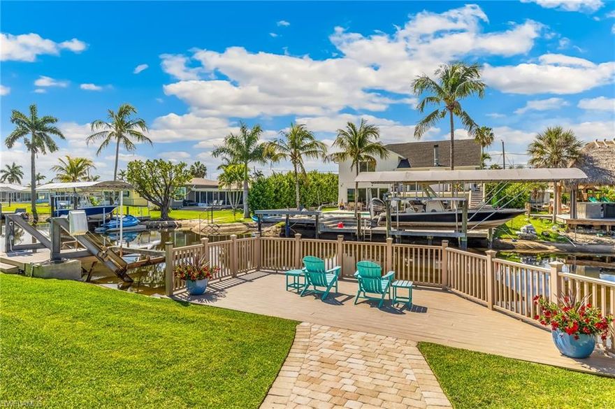 Stunning waterfront pool home on a canal with quick, direct Gulf access—just a scenic 20-minute boat ride to open Gulf and Lover's Key. A true boater’s paradise, this property offers the ultimate Southwest Florida lifestyle, from relaxing evenings on your private dock to soaking up the sun beside your brand-new heated pool.
This beautifully remodeled 3-bedroom, 2-bath home has been completely upgraded within the past three years with high-end finishes throughout. The open-concept floor plan centers around a designer kitchen featuring soft-close white wood cabinetry, premium granite countertops with matching backsplash, and new stainless-steel appliances. A stylish coffee bar with glass-front cabinets and integrated lighting adds both function and charm.
The kitchen flows seamlessly into the dining and living areas, where oversized windows and doors flood the space with natural light and provide tranquil views of the pool and canal. The split-bedroom layout offers privacy, with a guest bedroom and full bath on one side, while the primary suite—with en-suite bath—and an additional guest bedroom featuring a bay window are situated on the other. Step outside to your private oasis, where a brand-new oversized paver deck surrounds the heated fiberglass pool, offering both shaded and sun-filled lounging areas. The dock, complete with electric and a seating area, creates the perfect setting to enjoy peaceful waterfront views or prepare for your next boating adventure. Additional upgrades include plank tile flooring throughout, crown molding, tall baseboards, custom window treatments, and high-end lighting and fans. Major system updates provide peace of mind, including a new HVAC (2023), water heater, full electrical rewire, all-new plumbing, and a new epoxy garage floor and entry (2026). The roof was replaced in 2020. Hurricane-rated impact windows and doors were installed in the rear of the home in 2025, with double-pane windows already in place at the front. Meticulously maintained and filled with coastal charm, this move-in-ready waterfront home is the perfect blend of luxury, comfort, and boating lifestyle.