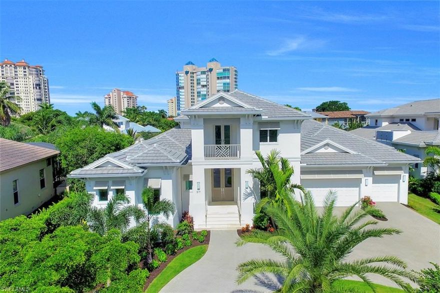 Experience Luxury, Paradise living at its best from this unparalleled location situated on a canal, in the charming area of Seagate,where small boats can navigate through Clam Pass to the Gulf and one can walk or bicycle to Seagate Beach Club.  From the moment you walk though the door you are taken by the Grand, Open Layout & Impeccable details “ Linen Coast Interiors” has created with the Luxury Furnishings & Exceptional, High Class finishings. This Elegant 2 story residence boasts 4 en suite bedrooms, + 2 Dens.Chefs Kitchen Includes double islands, wine fridge, & Separate Wet Bar, Top of the line appliances, Propane Gas: Wolf, Bosch & Sub Zero. It is also equipped with A private Elevator. This free flowing open floor plan affords effortless entertaining with the gourmet kitchen opening seamlessly to the great room, dining area, & spacious outdoor living space. Exterior features include: Brand new Seawall, Electronic Screens, gas powered salt water pool/ spa, & 3 car garage. Enjoy the Western Facing, Naples Cay skyline  while watching the sunset off your natural stone paved pool deck and/or the 2nd Floor balcony. Architect: Boyatt Designs Builder: T.B. Price Builders