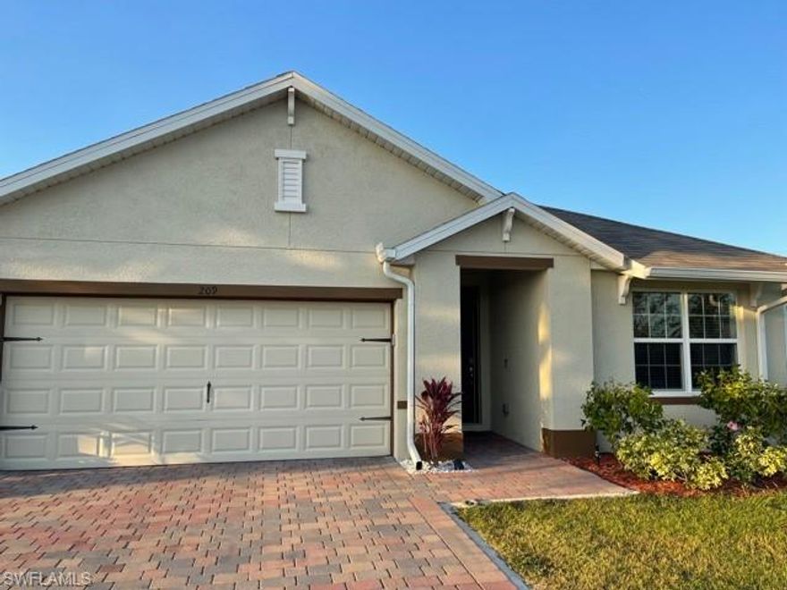 Beautiful home located in a desirable neighborhood of SE Cape Coral.3 bedrooms,2 bathrooms,ALL ASSESSMENT PAID!!!!,36"ASHBURN SIENNA KITCHEN CABINETS,Quartz kitchen countertops,,tile everywhere except the bedrooms, brick paver driveways and lanai, full irrigation system, electric garage door opener, home is connected security system,MAKE AN OFFER BEFORE PRICE GOING UP!!!