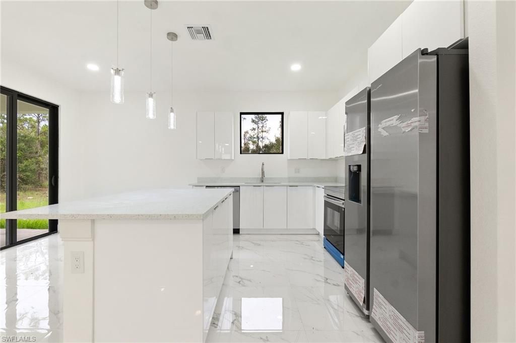 Photo of 2803 E 13th ST, LEHIGH ACRES, FL 33972 (MLS # 226017967)