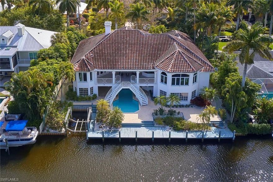 This home underwent a total renovation on the upper level in 2013-2014 with top-of-the-line finishes, yet has not had anyone using it so it is virtually BRAND NEW. The kitchen has Thermador appliances along with quartz counters and beautiful mother-of-pearl tiles that shimmer on the backsplash in the sunlight. 7" wide plank French Oak floors were laid throughout the home on the main level with 8" baseboards and 4" casings. The vaulted ceilings boast poplar beams as well as cypress beams in the master bedroom and open balcony. 8' solid wood doors were added throughout the home. All the bathrooms were finished with Carrara marble, Baldwin hardware and the master bathroom boasts a freestanding rectangular tub. As one enters the living room, one will see the beautiful floor-to-ceiling gas fireplace that will make the open rooms feel cozy and friendly when lit. The non-conforming space below has a recreation room with a kitchenette, a guest bedroom and 1 and 1/2 baths. There is abundant storage on the lower level as well as a 3-car garage. There is a space for an elevator should the buyer want to add one. Home is being sold "AS-IS".