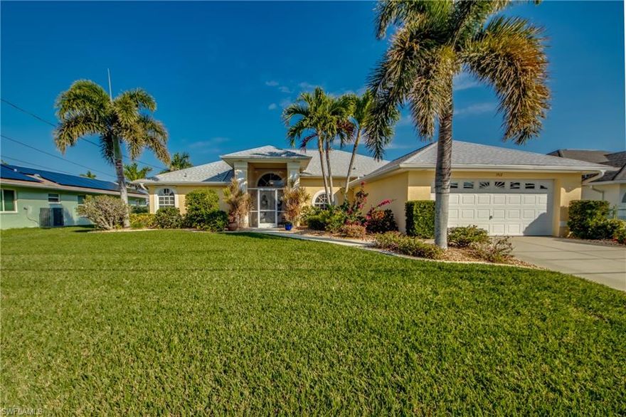 MOTIVATED!!  UNRESTRICTED DIRECT SAILBOAT GULF ACCESS in the SE Cape and 15 minutes to open waters!  Meticulously maintained and built in 2002 with 2,494 sq' living and 4 bedrooms/3 baths.  NO LOCKS/NO BRIDGES!  The Florida lifestyle awaits you with an ideal location near everything you need and want, including Cape Coral Hospital and other major Lee Health medical facilities within minutes!  NEW ROOF 2023 and entire pool enclosure re-screened 2022.  Double door entry to this exquisite Florida oasis you're immediately drawn to the pool area visible from all main living areas!  Super light, bright and spacious kitchen with gorgeous tile, white cabinets and contrasting dark granite countertops with island plus additional pull-out drawer cabinetry.  Granite countertops in guest baths and pass-through from kitchen to lanai.  Large pantry or use as utility closet.  Split floorplan with private Living room with access to pool deck and HUGE Family room with volume ceilings, surround sound audio wired and wide open to kitchen with sliders to pool and lanai entertainment.  Formal Dining area and separate Breakfast Nook.  4th bedroom easily used as a Den/Office!  Utility room with 2022  large capacity dryer, cabinets and utility sink with vanity.  Convenient Whole House Vacuum system.  The private and spacious Primary ensuite w/ walk-in closets and pristine primary bath with BOSCH Quick Response WATER HEATER with 2 sinks and separate bath tub and walk-in shower.  Heated Pool with dedicated Pool Bath along with accordian shutters to close off lanai and even a Sunsetter retractable awning!  Second refrigerator in the garage!  10,000 boat lift with boat canopy!  Beautiful lush manicured landscaping adorns the exterior, including plantings and floritam sod with irrigation.  Continuous professionally maintained services include:  Lawn, pool, pest control and HomeWatch services.  Pressure cleaned driveway, lanai and screened enclosure February 2025 along with newly painted pool deck and lanai.  No intrusion in this upscale beauty!  VERY LOW FLOOD INSURANCE PREMIUM!  ALL CITY UTILITIES INSTALLED and ALL ASSESSMENTS PAID IN FULL!  VIRTUAL TOUR plus DRONE VIDEO!