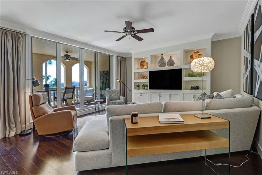 Best of the Best Bayfront has to offer! Exquisitely and tastefully finished, this popular 1518 sq. ft., two-bedroom open floor plan leaves nothing to be desired. It will satisfy the most discerning buyers presenting quartz countertops, marble backsplash, island kitchen, wood floors, matte black stainless steel appliances, impact windows and doors, custom built-ins, finished closets, and a new AC. The outdoor balcony is especially relaxing and overlooks the bay with full water views. Steps away from this residence are two pools, two spas, two tennis courts, bbq grills, a fitness center, and fine dining. Venture out for a short stroll from this Mediterranean waterfront village and visit Tin City, internationally acclaimed 5th Ave, or our white sugar sand beaches. Come see this beautiful, turnkey residence before it’s gone.