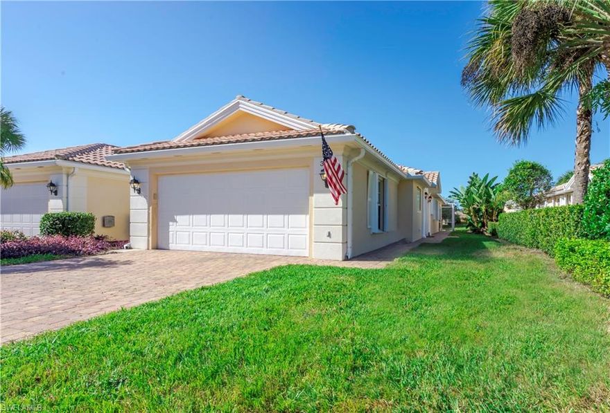 Are you a fan of our stunning Naples sunsets? Then this is the home for you! This 2 Bedroom 2 Bath Villa with an Attached 2 Car Garage has Western Exposure and is ready for you to move in and add your personal touch. You will be glad to be located in the newer section of IslandWalk, close to the Entry Gate and just a short stroll along the wide lakefront paths to the many Amenities offered at Town Center. Vaulted ceilings enhance the spatial quality of your Villa and the Split Bedroom Floor Plan offers privacy to all. The popular Open Kitchen is perfect for entertaining and the spacious screened Lanai overlooking the tranquil Lake is the perfect place to relax and enjoy our glorious Naples sunsets. This built solid Easy-Care home gives you time and money to enjoy the Naples lifestyle in this luxury Award Winning Community. Extras include Storm Shutters, Central Vacuum and a Security System. LOW FEES and NO CDD also include HDTV and High Speed Internet Service! Minutes from our glorious beaches and chic Mercato, Fifth Avenue and Third Street for the best in dining, shopping and entertainment. Come and make this your address in Paradise!