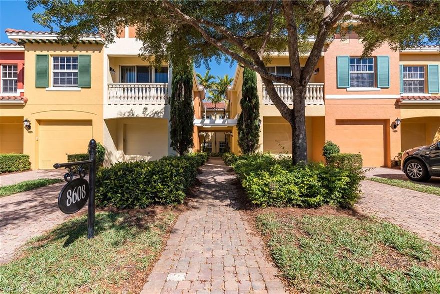 SHOWS LIKE A MODEL!  Meticulously maintained a true 3 bedroom coach home.  No stairs!  There are so many upgrades in this unit but to name a few, wood flooring, Plantation Shutters throughout, custom lighting, kitchen with granite counters, tiled backsplash, center island with seating, stainless steel appliances, LED lighting over and under cabinetry, BRAND NEW SHOWER  with seamless shower door in Master Bath , Beautiful water and fountain views from your kitchen sink, through Great Room and out onto the lanai. There is a whole house water filtration system, Hurricane shutters on the lanai, Polyaspartic garage floor with SOS overhead storage.  Phantom screen door on front door.  AC new in 2020.  See attached list of all the upgrades.  Rapallo is a Mediterranean style resort community with 5 star amenities such as two lagoon pools with rock grotto waterfalls, spa, screened jr olympic lap pool, clubhouse, library, tennis courts, fitness center, bocce ball, full time activity director will keep your calendar full of special events. Full time tennis pro and full time fitness director.  The best part, walk to the Coconut Point Mall, just minutes to the beautiful beaches and only 12 miles to the International Airport.