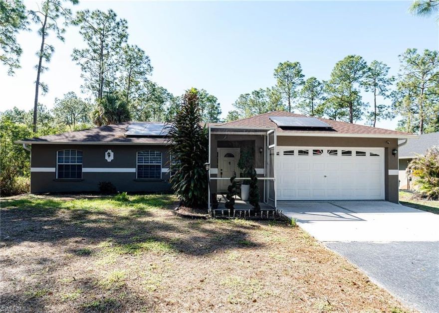 Welcome to 3780 8th Ave SE, Naples, FL 34117, located in the heart of Golden Gate Estates! This property sits on 1.14 acres and features a fully fenced yard, offering added privacy and space. The home includes fully paid solar panels, a 2024 roof, air conditioning system (2020), a reverse osmosis water system, a new water heater, a spacious kitchen, and a complete security system. Conveniently located just minutes from grocery stores and shopping, this home perfectly combines comfort and convenience. Enjoy the Florida lifestyle in the screened-in, tiled lanai, overlooking a large and private backyard. Step outside and experience the tranquility of nature with plenty of space for gardening, recreation, or even future expansions. With no HOA restrictions, you’ll have the freedom to truly make this property your own. Located in one of Naples’ most promising and rapidly growing areas, with upcoming infrastructure improvements such as the expansion of Vanderbilt Beach Road, you’ll enjoy peace and privacy while still being just minutes from shopping, dining, beaches, and everything Southwest Florida has to offer.
