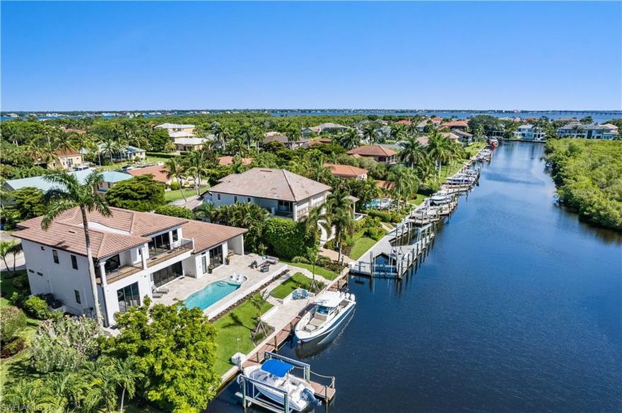 This Stunning, completely remodeled, Direct access waterfront home in Palmetto Point Features over 5600sf of modern luxury. 4 bedrooms all with ensuite baths(+ 2 half baths).The first level features an expansive open concept living area complete with wine room, a luxurious primary bedroom and absolutely gorgeous bath, a guest bedroom with ensuite, Office and the magnificent kitchen which features the finest high-end appliances (Wolfe and SubZero)gas cooking and an enormous island measuring 14ft x 6.5ft!! Just off the kitchen is a butlers kitchen and pantry outfitted with built in coffee maker, 2nd dishwasher and beverage fridge and space for everything. Even the well designed laundry rm is gorgeous! Upstairs there are 2 large bedrooms both with ensuite baths and a huge living area as well as a balcony that extends the width of the back of the house with gorgeous views of the water and preserve. The beautiful outdoor space includes a pool and spa that was also completely redone as well as an outdoor kitchen with built in gas grill, sink and beverage fridge all overlooking the water and preserve. Completing the package is the Boat dock with room for a large boat and a 10k lb lift.