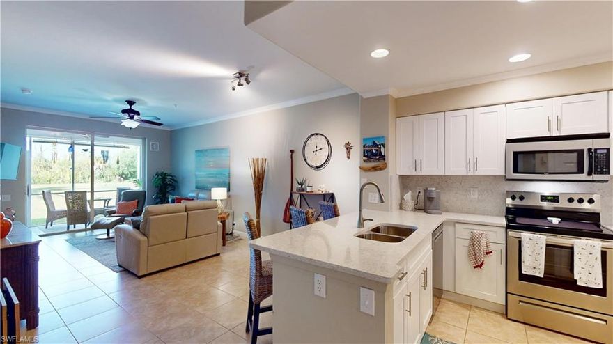 This beautifully maintained and fully furnished first-floor 2-bedroom, 2-bath “Stratford” condo is located just minutes from the beaches of Sanibel Island and Fort Myers Beach. Situated in the Golf Village of Lexington Country Club, this property includes a bundled golf membership within the HOA fees, offering exceptional value for golf enthusiasts. The condo features tile flooring throughout the main living areas, with comfortable carpet in both bedrooms. The updated kitchen showcases new cabinetry, quartz countertops, a stylish backsplash, and newer appliances. Both bathrooms have also been tastefully renovated with new cabinetry and a frameless shower door. Additional interior upgrades include new interior doors, door trim, and baseboards, giving the home a fresh and modern feel. A stylish modern barn door adds character while providing privacy for the guest bedroom and guest bathroom. Relax and unwind on the screened lanai overlooking the 14th tee box, offering a peaceful and private setting. The lanai also features acrylic sliders, allowing you to keep the space clean and enjoy it year-round. Additional conveniences include a storage closet just outside the unit and a designated covered parking space. Residents of Lexington Country Club enjoy an active and vibrant lifestyle with exceptional amenities, including 18-hole championship golf course, 12 lighted tennis courts with dedicated pickleball courts, 6 heated swimming pools, fitness center with onsite group classes, Island Club tiki bar/restaurant, Clubhouse restaurant, Beach area,3 bocce courts, and lending library. The beautifully maintained community also features 24-hour gated security and a lively social calendar with events such as Music Mondays at the Island Club, Bingo at the Clubhouse, and numerous clubs and activities to match a wide range of interests. This condo is offered furnished, allowing you to move right in and start enjoying the Lexington lifestyle immediately. Conveniently located near shopping, dining, hospitals, and Southwest Florida International Airport, everything you need is just minutes away. Be sure to view the virtual tour—either watch it or explore the interactive walk-through of each room.