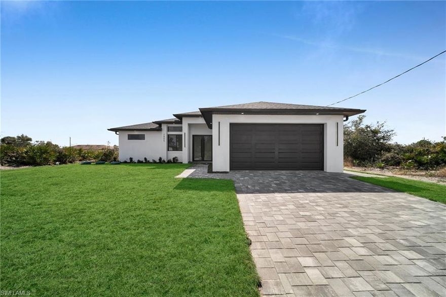 Brand-new construction offering 1,507 sq ft under air with a thoughtfully designed 3-bedroom, 2-bath floor plan plus an additional half bath conveniently located for a future pool. This modern home features an open-concept layout with high ceilings, oversized tile flooring throughout, and abundant natural light. The contemporary kitchen boasts quartz countertops, custom cabinetry with designer hardware, stainless steel appliances, and a spacious island ideal for entertaining. Impact windows and doors, sleek lighting fixtures, and quality finishes elevate the home’s modern aesthetic. The primary suite offers a spa-inspired bathroom with a glass-enclosed shower and stylish finishes. Enjoy a covered lanai overlooking a large backyard with plenty of room to add a pool. No HOA, no CDD, and located in a growing area with new construction surrounding—perfect for a primary residence or investment opportunity.