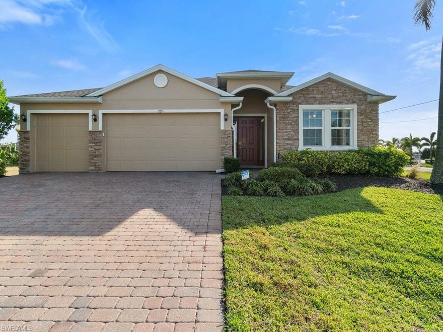 Welcome to your dream home in the highly desirable Surfside area of Cape Coral! This stunning 3-bedroom, 3-bathroom residence, with a spacious den that could easily be converted to a fourth bedroom, offers 2,333 square feet of modern living space. Built in 2017 and meticulously maintained, it feels like new with its fresh interior and exterior paint, a new roof installed in 2022, and a recently updated HVAC condenser in 2023. Additionally, the AC coil in the air handler was replaced just two years ago for improved efficiency. The heart of the home is the large open floor plan, seamlessly connecting the living, dining, and kitchen areas—perfect for entertaining or family gatherings. The kitchen boasts sleek stainless-steel appliances, granite countertops, a large pantry, and a functional center island that offers additional seating. The primary suite is an oasis of relaxation with dual walk-in closets, a luxurious soaking tub, a walk-in shower, dual sinks, and a private water closet. Step outside to enjoy the Florida lifestyle on your screened-in lanai, overlooking the large backyard with ample room for outdoor activities or even a future pool. Sitting on a corner lot, the property features a paver driveway leading to a generous 3-car garage. For added convenience, the garage includes a pull-down set of stairs leading to a plywood-floored attic, providing excellent extra storage space. Conveniently located near Veterans Parkway, this home is just minutes from top-rated schools, vibrant restaurants, premier shopping, and local parks. It’s ideal for families, retirees looking for a peaceful retreat, or young professionals seeking a central location with modern comfort. Don’t miss your chance to own this incredible property. Make this beautifully updated home yours today! Some Photos in this listing have been virtually rendered. Pool quote available for this home!
