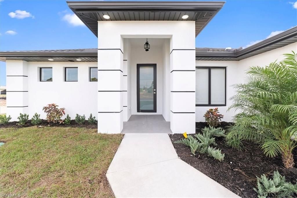 Photo of 3202 8th ST SW, LEHIGH ACRES, FL 33976 (MLS # 225084430)