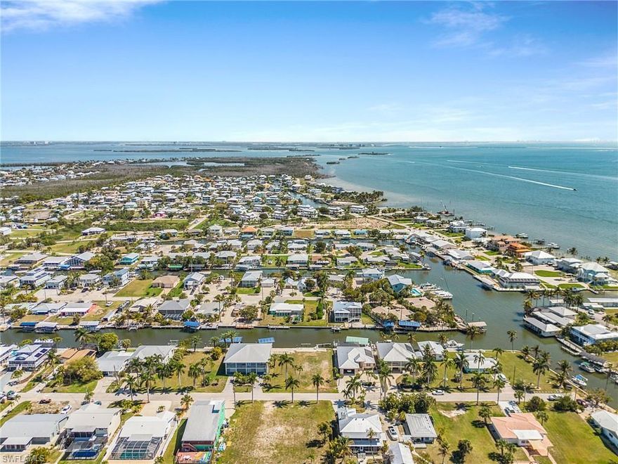 Oversized lot with the best waterfront access on Pine Island.  Perfect for a larger home.   This home site is just minutes to open water for you to enjoy fishing, waterfront restaurants, and the beautiful beaches of Sanibel, Captiva, Fort Myers, and Cayo Costa. Hop in your car or golf cart, ride your bike, or walk to the local restaurants and bars available in St James City, including Phuzzi's, The Waterfront, The Low Key Tiki, and Froggy's.  This lot has considerable savings on impact fees available since a home was removed from it.