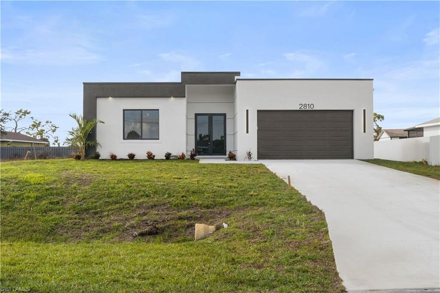 Discover this stunning new construction, move-in ready home located in the fastest-growing area of ??Cape Coral. Elegantly designed, it features 4 spacious bedrooms and 3 stylish bathrooms. Enjoy a gourmet kitchen with white cabinetry, tile flooring, and stainless steel appliances. A washer and dryer are also included for your convenience. The open layout seamlessly connects the living, dining, and kitchen areas, while the private backyard offers space for a pool and more. This home also features impact-resistant windows and doors, an automatic garage door, an irrigation system, and high-end finishes. Located in one of Cape Coral's fastest-growing areas, this property is ideal for families, seasonal residents, or investors, offering you peace of mind. Don't miss this incredible opportunity to own a high-quality home in a booming location!