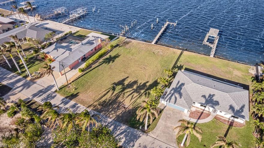 LARGE BAY FRONT LOT WITH A 100FT LONG DOCK AND SEAWALL! Absolutely Amazing views of Matlacha Pass!!! One of the very few Bay Front Lots left!! This oversized lot (over 1/3 acre) is ready for your new Florida Dream with waterfront views from both the front and rear of the home!!  There is an Incredible dock with concrete pilings and high end decking- 100ft long x 5ft wide with a 20ft x 5ft Landing at the end! The boating does not get any better from here!  You are a quick boat ride to Sanibel, Picnic island, and the Gulf of Mexico!! This is a great deal, lots similar to this on Fort Myers Beach and Sanibel sell in the millions! Make an offer today!