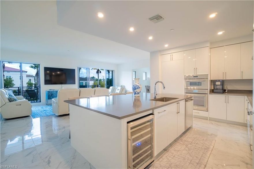 Desirable Corner-Unit Destin Floor Plan includes 2 assigned parking spaces. LAST Destin Floor Plan remaining! Downtown Old Naples Location within walking distance of 5th Avenue! The Third and Final Phase consists of 72 residences. 10' ceilings (except where dropped), 8' solid-core doors and impact resistant sliders. Thermador Appliance Package. Gas cooktop, stainless steel hood, under counter wine chiller, large working kitchen island. Contemporary cabinetry with soft-close doors and drawers. 42” uppers. Large open-air terraces and Outdoor Kitchen. Amenities: 90' lap pool with beach entry, cabana bar with 4 TVs and bar island seating, gas grills, hammocks, Bocce ball court, life size chess set, billiards, Courtyard Park with putting green, yoga lawn and fenced dog park. Community also includes a social room with catering kitchen, fitness center with private massage rooms, game room, theater, 6 guest suites and Community Beach Shuttle. Secure, under building garage parking, bike racks and climate controlled storage. Don't miss out on this new community.