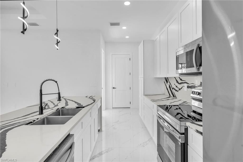 Photo of 3418 8th ST SW, LEHIGH ACRES, FL 33976 (MLS # 226005642)