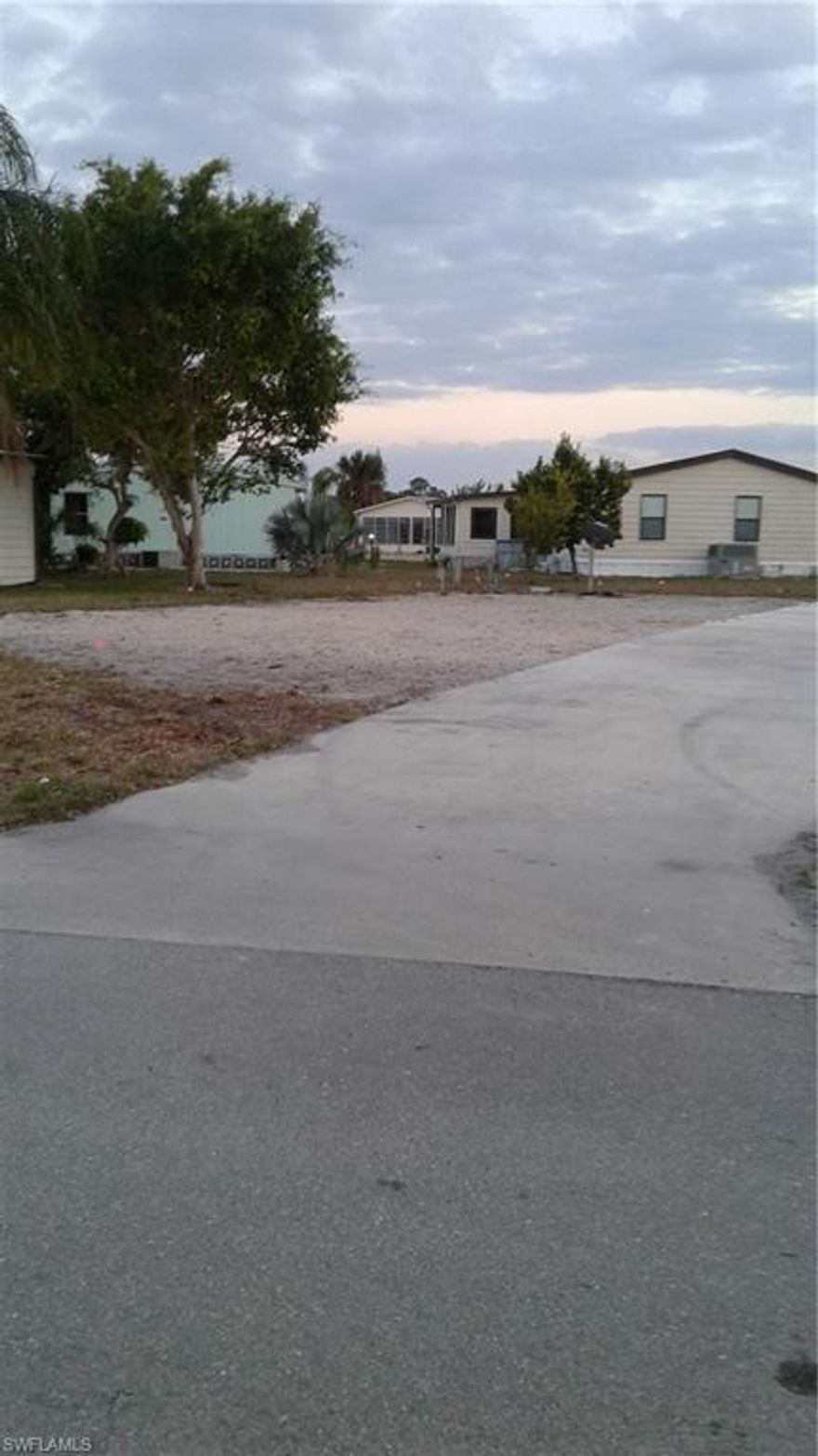 Only Lot in Spring Creek Village. Buildable lot, Modular, Manufactured or Single Family. Approved and getting a special exception from Bonita Springs you can build a stick built or concrete block.  Call today.  The lot includes a share in the amenities corporation and the Bonita Springs Utilities water and sewer assessment has been paid off. That is a $15,000 value that is included in the sale.  Home was torn down after the hurricane. Call today.