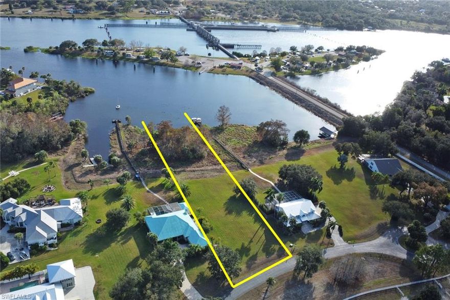 Riverfront opportunity in the deeded community of Riverwind Cove, offering expansive views of the Caloosahatchee River. This cleared homesite spans nearly 1.1 acres with over 100 feet of direct river frontage, providing an ideal setting to build a custom estate home. Riverwind Cove is an upscale community featuring underground utilities, street lighting, and an equestrian center, blending privacy with thoughtful planning. Conveniently located near the Franklin Locks boat ramps and nearby state parks offering camping and hiking, with Fort Myers just 15 minutes away. A rare chance to capture Old Florida charm at an exceptional value. All serious offers will be considered.