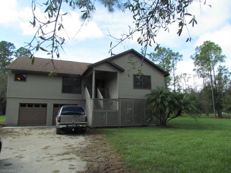 A MUST SEE FOR COUNTRY LOVERS! This beautiful custom home features 3 bedrooms, living room, family room, breakfast room, huge gourmet chef kitchen with stainless appliances including Propane Gas range, upgraded wood cabinets, granite counters and breakfast bar. All tile floors! French doors open from the family room to balcony overlooking lawn and woods. Play house and pond also on property. All living area on 2nd main floor of home! Under home finished area of 560 sq ft includes 2 car garage shortened & used as storage(easily converted back to full depth garage.  Under cover carport will accommodate 2+ cars! Downstairs finished bathroom with outside entrance is perfect for adding a pool or just for working outside! Many upgrades within past 2 years! Propane tank on property (leased at $50. per year) can be used for range, dryer, or gas grill!