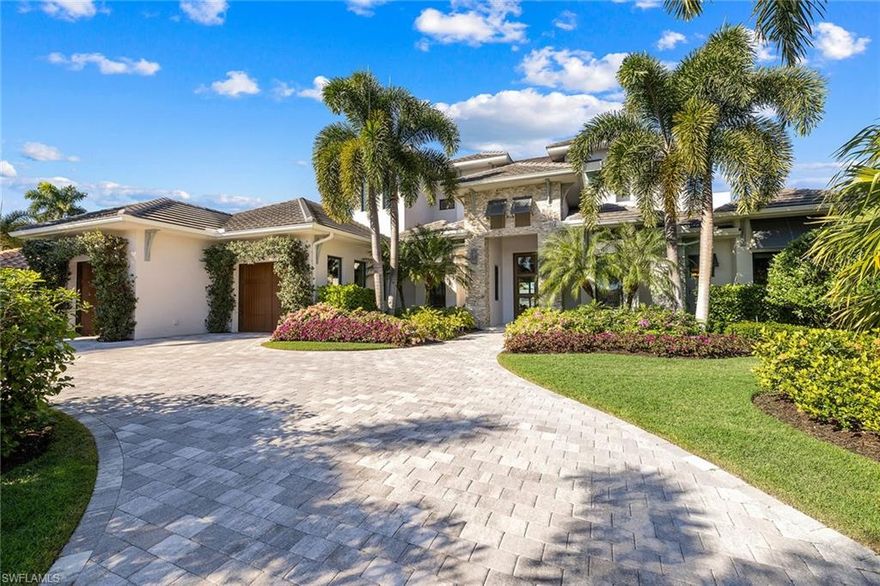 This upscale Royal Harbor boating home designed by LOTUS Architecture performed exactly as designed through Hurricane Ian. Offering lush landscaping, a spacious interior with generous room and exquisite finishes on every surface. Guests are welcomed through a grand stone-laden entrance to a foyer with soaring ceilings and a living room with a custom granite fireplace surround and water view. The gourmet kitchen flaunts show-stopping, Italian-made Snaidero cabinetry in its sleek design, with rich grain textures and concealed cabinet pulls. Select Bosch appliances, a Thermador wine cooler and a single streamlined sink set in pristine quartz countertops complete the scene. Remarkable flooring begins on the first floor with a wide-plank French oak crafted in Belgium. Custom tile in every bath adds a clean finish. Three fireplaces warm the great room, lanai and second-floor balcony. Florida outdoor living begins on a multileveled travertine lanai with an elongated pool, fit for swimming laps alongside a spa with a cascading spillover. A new dock flanks the entire rear of the property and features a sunbathing deck and boat lift, perfect for local boating and easy Gulf access.