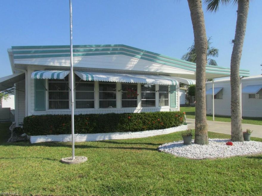 Own Your Own Lot & A Park Share Too... Sunshine Mobile Village. An Active 55+ Community. Just Minutes From Sanibel Island, Outlet Shopping & The Beaches. Location. Location. Location. 2 Bedroom - 2 Bath Home Features Separate Family Room. Side Porch With Laundry - Workshop. Parking For Two. New Roof And Siding. This Home is Pampered. Agents Please Use Far Bar " As Is" Contract And Proof Of Funds With Your Offer. 
Maintenance Fee: $ 35.00 Monthly. 2013 Taxes $ 855.00