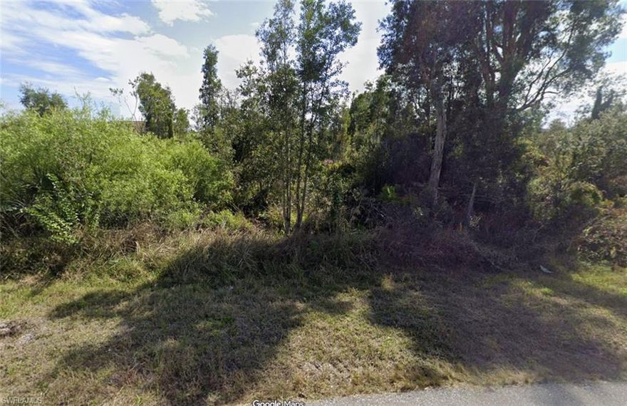 Excellent build-ready single-family residential lot in the heart of Lehigh Acres, Florida. This approximately quarter-acre parcel at 2703 36th Street SW offers a rare opportunity to own a level, wooded lot with no HOA and no deed restrictions, ideal for a custom home or investment build. Located in a growing Southwest Florida community, the property is conveniently situated near major roadways, schools, shopping, and dining, providing the perfect balance of peaceful neighborhood living and easy access to everyday amenities and regional hubs. Utilities are available nearby, and the lot is surrounded by both new construction and established homes. Don’t miss the opportunity to secure this well-located residential lot! Picture may not reflect the actual lot due to growing vegetation and other.