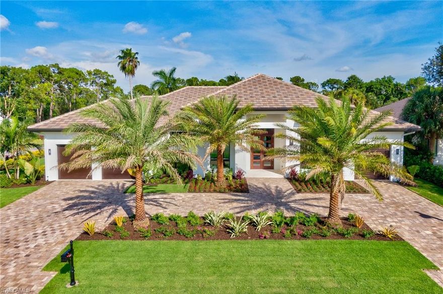 H.15993-What is luxury today? It is not an over-sized home with seldom used space! In Naples, FL luxury is this Coastal Contemporary home on a quiet cul-de-sac, in close proximity to the upscale Waterside Shops, the renowned ARTIS Center of Performing Arts & the Baker Museum. It’s exclusive access to the Pelican Bay amenities of beach, tennis, fitness & golf w/ private membership. Luxury is also simplicity of style & superior craftsmanship evident in every detail. You'll love the neutral and organic materials of wood and natural stones throughout this exquisite home. Its open, balanced footprint with flexible spaces caters to any lifestyle. Modern amenities include a smart home system, state-of-the-art sound system, and functional half kitchen–the modern day Butler’s Pantry for food prep when entertaining. Built for those who embrace a true indoor/outdoor lifestyle! From the moment you step through the front door, you are drawn to the dramatic backyard water feature & pool. Large outdoor living room with custom cypress ceiling, grill & fireplace with mechanical drop-down shades & shutters provides a year-round space for the ultimate in Florida living at Pelican Bay.