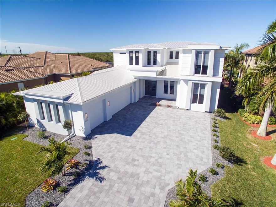 Stop Dreaming Start Living---This Sleek, sophisticated elegance greets you at the curb of this state-of-the-art contemporary model and continues throughout nearly 4,000 square feet of celebratory living spaces. Despite its size, this home flows seamlessly on both levels and boasts surprising design masterpieces. The highly unique and functional floor plan includes identical upper and lower master suites, each with over sized baths featuring dual closets, walk-in showers and freestanding tubs. The second floor is an ideal hub for family or guests, with a game room plus two additional guest suites with their own full baths. The first-floor living space is both gourmet and comfortable, offering a central great room under 12-foot ceilings. An over sized kitchen is a chef’s dream with two islands and a large dining nook, large walk-in pantry and adjacent laundry. A study and pool bath completes the first floor. Pocketing sliding doors open most of the living space to the pool, lanai and summer kitchen, providing for indoor-outdoor dining and stargazing. To the front, a three-car, side-load garage stores beloved automobiles and toys without detracting from the home’s stunning profile.