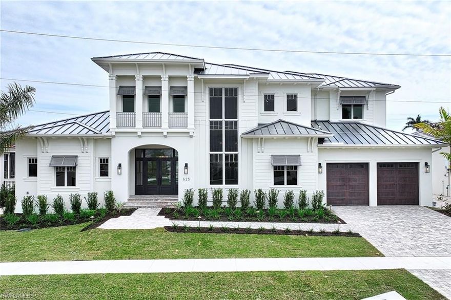 Step into a realm of coastal contemporary opulence and exquisite architectural craftsmanship. Nestled within Marco Island, this waterfront marvel stands as a testament to the unparalleled expertise of The Lykos Group. Drawing inspiration from the charm of Old Naples Cottages, this residence spans 5,400 square feet under air, boasting a seamlessly integrated open floor plan that effortlessly merges the great room, kitchen, dining area, bar, and family room into a lavish haven, ideal for hosting guests in unparalleled style. The gourmet kitchen is a culinary paradise, equipped with top-of-the-line appliances and an expansive island, ensuring every meal is a masterpiece. With five bedrooms and seven bathrooms, there's abundant space for both family and guests to unwind and indulge. The luxurious master suite, conveniently located on the first floor, offers private access to the pool and spa, while the remaining four en-suite bedrooms grace the second floor, accompanied by a spacious games room and living area accessible via a private home elevator. Outside, the backyard unfolds as a private sanctuary, featuring a covered Lanai adorned with electric screens and shutters, a sparkling pool, spa, outdoor kitchen, and lush tropical landscaping—an idyllic retreat for relaxation and rejuvenation. Positioned facing south, with effortless boat access and unobstructed views of the channel leading out to the Esplanade and Collier Bay, this home epitomizes waterfront living at its finest.
