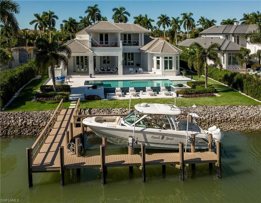 2017 built Port Royal Waterfront Home. This property features 100' of canal frontage w/ quick access to the gulf. The coastal contemporary home welcomes you into the stunning living/dining/kitchen/family great room framed by a wall of accordion doors that fully open to the expansive outdoor living area. The 6,874 sq/ft five bedroom plus office and den/salon includes Legno Bastone floors throughout.  The kitchen features two islands w/ quartz surfaces, extra fridge drawers, Miele appliances, wine cooler, and Butler’s pantry. The 1st floor master bedroom includes a bathroom suite w/ walk through shower, two commodes, soaking tub and California Closets.   You’ll also find a relaxing sitting area with beautiful morning light and water views. Upstairs you will find a gathering room with sunset terrace, three guest bedrooms, and a 2nd master suite that includes a huge sun deck overlooking the pool and canal. Also, the home includes a private elevator w/ garage, first and second floor levels, a second upstairs laundry, Lutron lighting, audio speakers throughout, security system, impact resistant glass, electric screens and hurricane protection. Port Royal Club membership eligible.