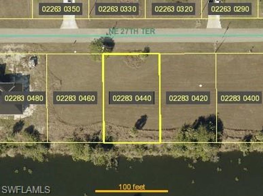 Nice building site on freshwater canal with southern exposure! Fast growing area, convenient to US 41, Pine Island Rd, parks, shopping, restaurants & more! City water and sewer now available! Buyer assumes balances of assessments. Adjacent site at 1810 NE 27th ter is also available. Buy both and combine into one huge building site or own two separate building sites!