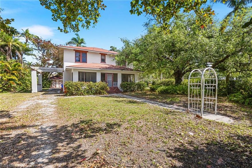 **Step back in time at 1421 Steele Street — a true Fort Myers treasure celebrating its 100th birthday.**  

This enchanting 1925 Craftsman-style home is a rare time capsule, with many of its original features still intact. From the graceful windows to the  original wood floors beneath your feet, every inch tells a story. Classic tilework, vintage light fixtures, and a wood-burning fireplace in the living room evoke a bygone era of craftsmanship and charm.

The home's flowing floor plan includes four spacious bedrooms, two full baths, and one half bath — all generously sized and filled with character. An attic fan whispers of simpler times before central air, and while this home will require extensive restoration, it offers the bones and soul of a masterpiece waiting to be brought back to life.

Relax on the expansive screened front porch and wave to neighbors beneath the dappled shade of the mature tree out front. A porte cochere adds vintage flair and shelter to the driveway, leading to a detached two-car garage — a rare find in historic homes. The property is wrapped in a tall privacy hedge, offering quiet solitude in a setting that feels almost untouched by time.

Just minutes away from the vibrant downtown Fort Myers River District, enjoy easy access to boutique shopping, art galleries, live music, and delicious dining. Nearby Edison and Ford Winter Estates honor the spirit of innovation and history, while the Caloosahatchee River invites you to stroll, paddle, or picnic along its scenic banks.

For those who appreciate the craftsmanship of the past and dream of breathing new life into a piece of history, 1421 Steele Street is more than a home — it's a legacy. Restore it, cherish it, and become part of its enduring story.