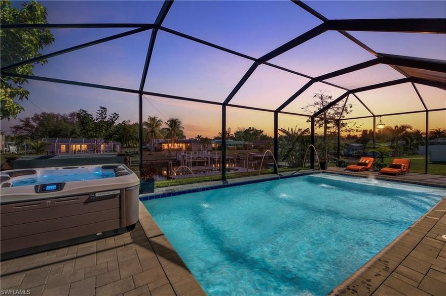 Built in 2024 and thoughtfully upgraded throughout, this exceptional waterfront home offers the strength and efficiency of new construction combined with easy Gulf access. No waiting, no projects, just move in and start boating.

Located on a navigable canal with convenient access to open water, this property is ideal for boaters who want to spend more time on the water and less time navigating. From your backyard dock to the Gulf, enjoy quick access to fishing, waterfront dining, shelling, and island hopping while being centrally located near schools, shopping, restaurants, and everyday conveniences.

Constructed with engineered concrete block and elevated design, the home features roof trusses rated up to 160 MPH, impact rated PGT windows and doors with bronze frames, an impact rated garage door, 200 amp electrical service, high efficiency 16 SEER HVAC system, and a tankless water heater for long term efficiency and peace of mind.

Inside, large format tile flooring runs throughout the main living areas beneath recessed tray ceilings and upgraded trim work. The kitchen is designed for both entertaining and everyday living with granite countertops, soft close cabinetry, stainless steel appliances, an upgraded range hood, stylish tile backsplash, and a propane gas range delivering the precision serious cooks appreciate. A large center island provides generous prep space and seating.

The home is also equipped with a buried 125 gallon propane tank serving the gas range, outdoor grill connection, and a dedicated generator hookup, offering added convenience for outdoor cooking and valuable peace of mind during storm season.

The expanded primary suite offers dual vanities, full height upgraded shower tile, and a frameless glass shower enclosure creating a clean and modern retreat.

Outdoors is where this property truly shines. The custom 14 x 28 screened pool includes a heat pump for year round enjoyment, brick paver deck, upgraded enclosure framing, completed professional landscaping with irrigation, and a convenient outdoor shower. A hot tub is also included and remains with the home.

For boaters, the composite captain’s walk dock includes water and electric service along with a brand new boat lift that has never been used. Launch directly from your backyard and be on your way to open water in minutes.

Recent 2024 construction, impact protection throughout, completed pool, dock and lift, easy Gulf access, propane generator readiness, and a prime location close to schools, shopping, and dining create an exceptional opportunity to enjoy the Southwest Florida waterfront lifestyle immediately.