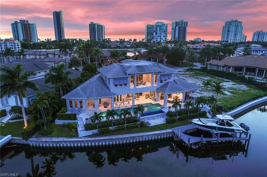 This residence is a sophisticated, waterfront retreat that reflects the miraculous incorporation of inspiration and architecture. Created by its owners, Lexa Homes LLC, this home is a masterpiece of exquisite design and craftsmanship featuring hand-rubbed European white oak floors, a 740 bottle wine room, individually selected lighting from Fine Arts Lamps, plus an elevator to transport from floor to floor. This efficiently designed home features the master suite, one en-suite guest room and two offices/dens on the first floor. Sprawling entertaining spaces flow outside to the outdoor living room past the well-appointed summer kitchen and infinity edge pool to the expansive bay waters where the 40 foot dock houses a 20,000 lb boat lift, equipped with a kayak lift and launch. Thoughtful consideration was taken when designing the private, second floor guest entrance. The exquisite spa-inspired master suite has a relaxing sitting area overlooking the bay, with a private entrance to the spa and pool deck. The master bath features a multi-spray shower, a walk-in sauna, dual water closets and expansive walk-in closets. This home is the epitome of waterfront luxury.