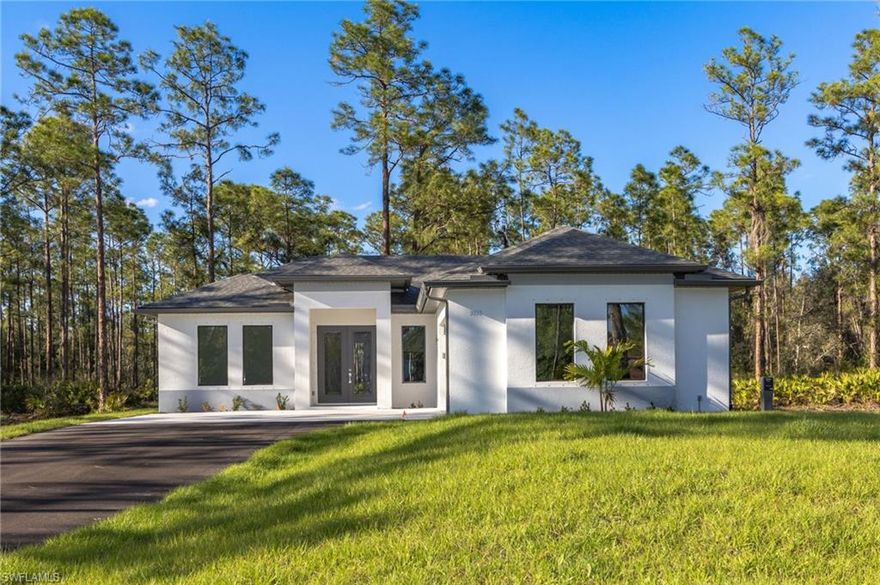 Lovely 3 BEDROOM PLUS DEN, new construction situated on a ALL UPLANDS 1.14 acre lot, NO HOA, in the fast-growing Golden Gate Estates, Naples. Just a few minutes from supermarkets, pizza parlor, nail salon, and more. This high quality, beautiful new-build showcases an open floor plan with great attention to details. A bright and airy main living space; light filled den; tile throughout; fresh white kitchen with quartz countertop, a waterfall island, beautiful light colored backsplash, and 42" wood cabinets; soaring high tray ceilings in the living room and master bedroom; 8-ft doors; impact windows and doors; automated sprinkler system; and asphalted driveway. Golden Gate Estates is the perfect combination of peaceful, rural setting, just a short driving distance from all the amazing amenities Naples has to offer. PICTURES ARE FROM THE SAME MODEL BUT NOT ACTUAL HOUSE.There will be some variations. CHECK OUT THE VIDEO WALKTHROUGH OF A SIMILAR MODEL HOUSE! Ready by the end of September.