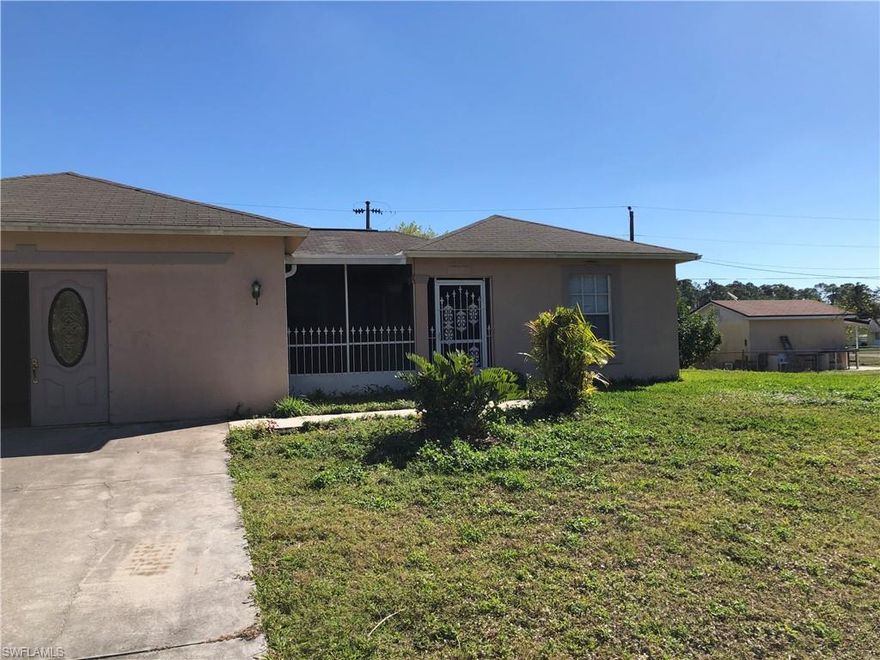 Large 4 Bedroom 2 bathroom home with a large extra room that could be a large bedroom, den or family room. Tile throug out except for the 4 bedrooms. Large breakfast bar and inside laundry room. New roof in 2022. Close to shopping, dining and quick access to SR 80, Labelle and Fort Myers.