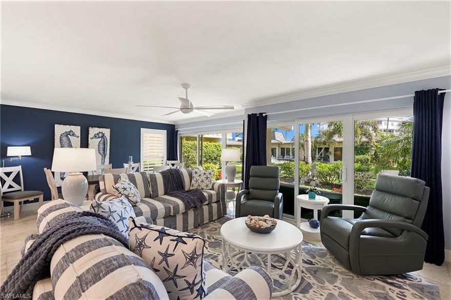 An exceptional opportunity awaits in Ville de Marco — a community of 100 residences where only eight were designed as double units. Even more compelling, just two are currently available, making this offering one of the rarest ownership opportunities in the entire complex. This beautifully reimagined 2-bedroom, 2-bath residence has been completely renovated with an emphasis on quality craftsmanship, functionality, and refined coastal style. The redesign enhances natural light and optimizes every inch of interior space. Improvements include impact-resistant windows, doors, and sliders; custom-designed kitchen cabinetry; upgraded appliances; elegant crown molding; plantation shutters; and the convenience of a private in-unit laundry area. Thoughtfully integrated bunk accommodations provide additional flexibility for guests or extended stays. The location within the community is a true advantage. Positioned on the quieter side of the property, the residence enjoys a more peaceful setting, away from evening restaurant activity,  while still being just a short distance to Marco Island’s popular waterfront dining and local favorites. It’s a balance that truly enhances everyday living. Set along the scenic Marco River, the lifestyle here is what island dreams are made of. Enjoy frequent dolphin sightings, cast a line from the community fishing pier, gather at the waterfront clubhouse, or lease a boat slip and head out to explore the Gulf waters at your convenience. Whether you’re searching for a personal island retreat, a seasonal residence, or an income-producing investment, this distinctive double unit combines rarity, location, and lifestyle in one of Marco Island’s most charming waterfront settings.