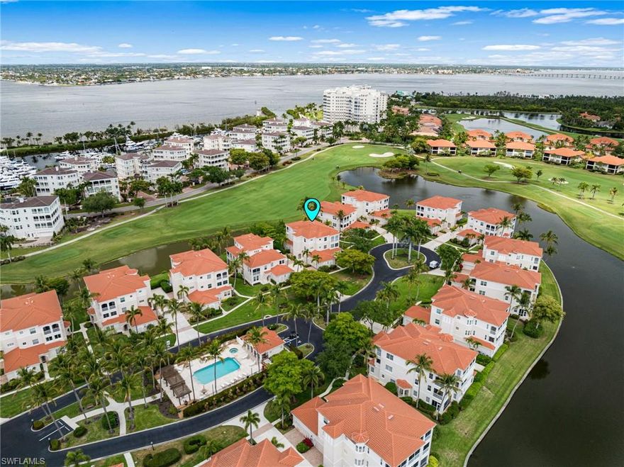 Nestled within the highly sought-after Harbour Links enclave of Gulf Harbour Yacht & Country Club, this beautifully maintained, move-in-ready residence offers an effortless blend of elegance and comfort—complemented by breathtaking sunset views each evening. Offered turnkey furnished and ideally positioned on the first floor, the home includes a private two-car garage just steps from the community pool. A gracious great room floor plan welcomes you in, flowing seamlessly to a screened lanai that captures sweeping lake and golf course vistas across the 10th fairway.

Inside, tile flooring extends throughout the light-filled living spaces, enhancing the home’s airy, refined ambiance. The thoughtfully updated kitchen is both stylish and functional, featuring quartz countertops, a farmhouse sink, new light gray cabinetry with soft-close doors and drawers, pull-out pantry shelving, a breakfast bar, a wine cooler, and a full suite of white appliances. Additional upgrades include a new refrigerator, tankless water softener, and a 2022 A/C system, while plantation shutters throughout add a timeless, upscale touch.

The spacious primary suite serves as a private retreat, complete with a well-appointed en-suite bath. A bright and inviting guest bedroom offers comfort and privacy, while the second full bath is enhanced by a seamless glass enclosure with a chic barn door design. The versatile third bedroom, featuring glass-paneled French doors, is ideal as a den, office, or additional guest accommodations.

Further elevating the home are electric storm shutters, designer ceiling fans, extensive crown molding, and a two-car garage with built-in storage and a workbench. Optional private memberships are available, offering access to Gulf Harbour’s world-class amenities and an elevated lifestyle of leisure and luxury.