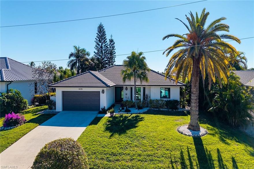 Welcome to 1035 Admiralty Ct, a beautifully updated waterfront residence offering the ideal blend of coastal comfort and boating functionality. This 3-bedroom, 2-bath home, located on a quiet cul-de-sac with desirable southern exposure, showcases thoughtful upgrades throughout and provides water access beneath Marco Island’s highest vertical bridge clearance at 14 feet, allowing you to fully take advantage of the 20,000-lb boat lift. Although the stated square footage may appear modest, the home’s footprint and floor plan live large, creating an open, comfortable flow that feels far more expansive than expected. Tile flooring runs throughout the entire home, enhancing durability, cohesion, and easy maintenance, perfect for the island lifestyle. The property is being sold furnished, with inventory included, making the transition seamless for full-time or seasonal living. A comprehensive list of recent improvements positions this home as the right choice in today’s market, including a new tile roof (2021), impact-rated hurricane windows and doors (2022), a new seawall (2023), new dock with Azek decking (2023), 20,000-lb boat lift (2023), and a new hurricane-rated garage door (2023). An electric vehicle charger in the garage adds modern convenience. These substantial upgrades not only enhance daily living but also translate into valuable insurance credits and, more importantly, peace of mind when inclement weather strikes. Notably, the home has experienced no water intrusion or flooding during any recent major storms. Ideally situated near Marco Town Center and Veterans Park, this residence offers convenient access to dining, shopping, community events, and green space, while still enjoying the privacy of a waterfront setting. 1035 Admiralty Ct represents a rare opportunity to own a well-maintained Marco Island waterfront home where the major improvements are already complete, allowing you to focus on enjoying the boating and island lifestyle.