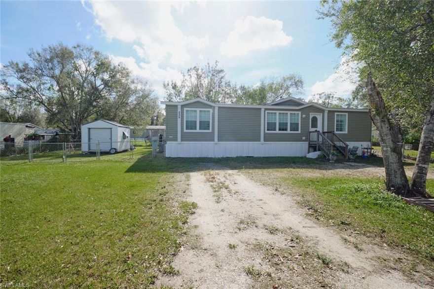 Price Drop + SELLERS WILLING TO HELP WITH CLOSING COSTS!!!!! Come check out this 1664 sq ft very popular, well built 2016 Jacobson Manufactured home, on an almost Half Acre lot. This gem offers an open-concept split floor plan great for a family and entertaining w/ wood-like flooring throughout for easy cleaning & maintenance.  The massive kitchen offers large island w/ seating, tons of cabinets & counter space, complete w/ all the necessary appliances, and a huge hidden walk-in pantry. Just off the kitchen is an interior laundry room complete w/ Washer & Dryer w/ extra storage space. Other features include security system, fenced-in backyard for the kiddos and/or fur babies, & exterior shed. Take a walk, bike ride, or short drive into downtown LaBelle where you will find cute shops, restaurants, the park and Wharf where all the festivities happen along the river. LaBelle is a highly desired adorable town to retire or raise a family & is centrally located inland close to some of the best fresh & saltwater fishing, about 2 hours from Miami, Orlando, and Tampa for all your theme park activities, and about 45 mins from the beaches. Schedule Your Showing Today!