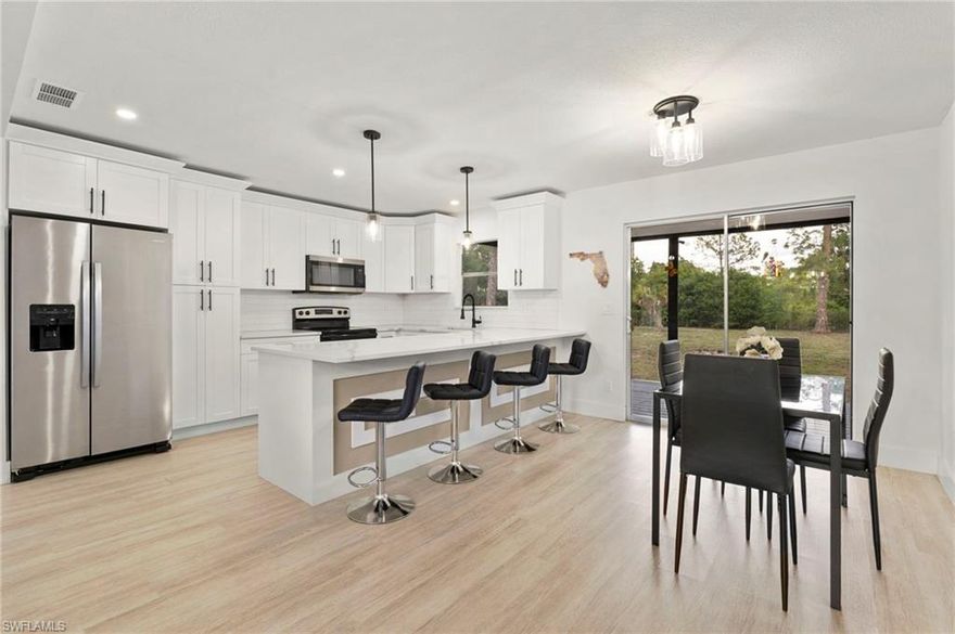 Welcome to 614 Canton Ave, where modern updates meet space, privacy, and endless possibilities. Situated on an oversized half-acre lot, this beautifully remodeled 3-bedroom, 2-bath home offers the perfect blend of comfort, style, and functionality. Step inside to a bright and inviting open-concept great room designed for both everyday living and effortless entertaining, featuring a clean, contemporary feel throughout. Nearly everything in the home has been updated within the last 4 years, giving buyers peace of mind and true move-in ready convenience. The well-appointed kitchen serves as the heart of the home with newer appliances, ample cabinetry, and a functional island ideal for cooking and gathering. The spacious primary suite provides a relaxing retreat, while the additional bedrooms offer flexibility for guests, family, or a home office. Enjoy Florida living year-round on the screened lanai, perfect for morning coffee or evening relaxation, and take advantage of the expansive backyard with plenty of room to add a pool, store recreational toys, or create your own outdoor oasis. Additional features include laminate flooring throughout, an attached garage with laundry, and the cost-saving benefits of well & septic. With no HOA restrictions or fees, you’ll enjoy the freedom to truly make this property your own. Located in a quiet area of Lehigh Acres with convenient access to shopping, dining, schools, and major roadways, this home is ideal for first-time buyers, seasonal residents, or investors looking for a fully updated property on a rare half-acre lot. Don’t miss this opportunity to own a move-in ready home that offers both modern upgrades and room to grow.