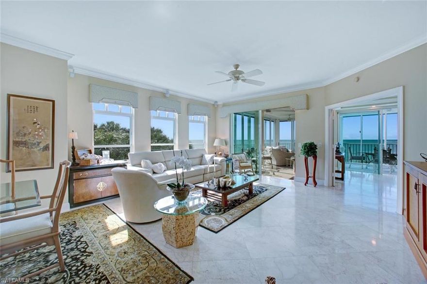 RARELY AVAILABLE 3 BED, 3 BATH END-UNIT IN NORTH NAPLES’ COVETED BAREFOOT BEACH CLUB! Enjoy endless SOUTHWEST Beach views, down the coast to Naples’, with breathtaking sunsets from your Gulf-front wrap-around lanai. This immaculately maintained beachfront retreat is finely appointed with high ceilings, gorgeous marble floors, and an air-conditioned panoramic lanai with automatic shades & screens, allowing you to enjoy the Gulf view either screened or open air – an incredibly rare feature in the Barefoot condos. Enjoy extraordinary natural light via extra windows that are only available in an end unit. Incredible entertainer’s kitchen with professional grade cabinets & granite countertops. Absolutely beautifully maintained, this pristine unit is neutral & move-in-ready. Nearby to the BRAND NEW CLUBHOUSE with state-of-the-art fitness center & resort-style pool. Barefoot Beach residents enjoy 3 miles of beach, 2 pools/spas, manned/gated entry & on-site mgmt. The OPTIONAL “Club at Barefoot” offers boat slips, tennis, 2 restaurants & beachside food/bev/chair service. Excellent Collier County location minutes to Mercato, Waterside & easy access to RSW Airport.