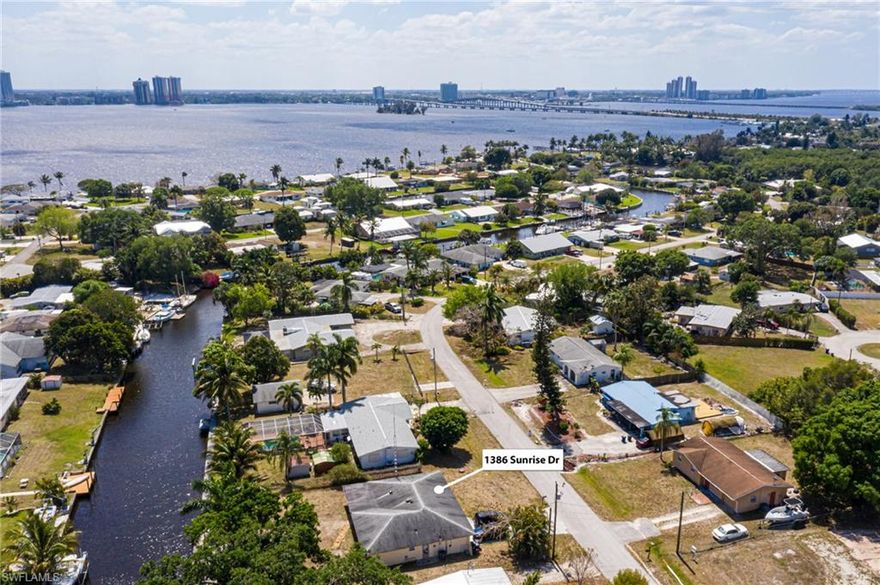 **Multiple Offers received - Seller accepting offers until 6 pm on Tuesday, April 5** Welcome to Florida!  This Sailboat access home in North Ft. Myers is just a few minutes from the Caloosahatchee River.  Boat to lunch or downtown Ft. Myers for the festivals.  Or keep traveling to Sanibel, Ft. Myers Beach and the Gulf! The expansive concrete dock across the back of the property is also great for relaxing and enjoying the playful dolphin or catching some big fish!  This tiled home comes with newer Kitchen cabinets and Granite countertops, 2 year old appliances, newer A/C and electrical panel, architectural shingle roof (2012) updated bathrooms, and new garage door.  The large yard offers plenty of room to add a pool.  Come find your "Peace" of Paradise!