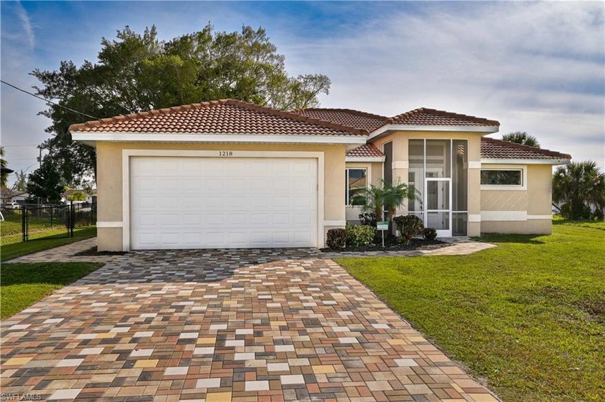 Beautiful! Like New Home!!  Perfect SW Cape Coral location and an interior that is in immaculate condition.  Home consists of over 2,000 sf of living area, 3 bedroom, 2 bathrooms, and 2 car garage.  Less than five years old this home has several high end features.    Some of the features include Concrete Title Roof, Hurricane Impact Glass throughout, Paver driveway and entry, Granite counter tops, walk around double headed shower, and many more.  Enjoy dinner on the back patio and fun for the dog and kids in the fenced in back yard. This home will impress the pickiest of buyers.  Call today to schedule a private showing.