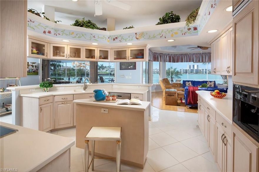 Long, wide water bay views are the focal point of this sprawling one-level home on Venetian Bay. Featuring sought after western exposure, over 100 ft of waterfrontage and an expansive outdoor area with both covered and uncovered spaces, the sunsets here cannot be beat. Copious amounts of glass along the back of the property provide a light and airy feel while providing views from nearly every room. Open kitchen, spacious master suite and high ceilings make this an ideal place to enjoy the Naples waterfront lifestyle. Located just a short stroll from shopping and dining in the Venetian Village. Moorings residents have the ability to join the Moorings Beach park which is only a short bike ride away.