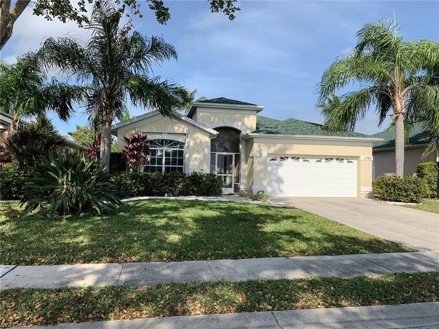 If you are looking for privacy, security and the safety of a gated community, this is the home for you.  This 3 bedroom 2 bath house features granite in kitchen and baths, updated stainless steel appliances, laminate and tile flooring, large screen lanai, electric hurricane shoulders and underground irrigation system.  This neighborhood features a year round heated pool, a park, and a playground. The lake has a beautiful fishing pier and sandy beach. All costly assessments are paid!