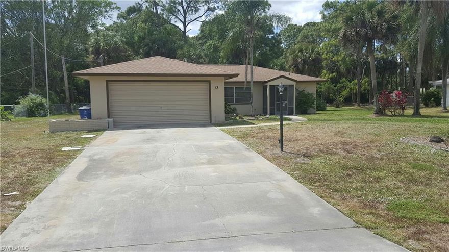 2 bedroom 2 bath pool home on a 1/2 acre located in central Lehigh.  Tile and carpet floors throughout.  The home is on a dead end street for added privacy.