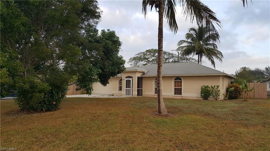 Move in ready condition!!! Beautiful three bedroom two bath home with two car garage. Perfect location on large corner lot which offers lots of privacy and a large fenced backyard all fence in with fruit trees and plenty of room for a pool! Great neighborhood for family and kids. Home features updated kitchen with Reverse Osmosis system, updated bathrooms, crown molding, vaulted ceilings, hardwood floors and tile throughout. Large covered lanai with beautiful large tile on the diagonal.  Close to Naples great shopping, dinning and the beach.