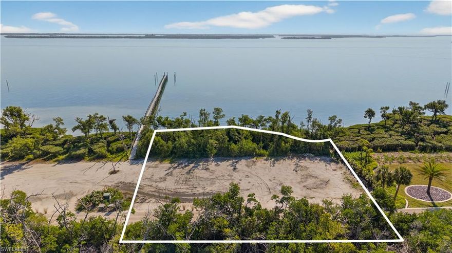 This oversized lot 440 in the Collier Preserve section of Useppa Island boasts 150 feet of water frontage on Pine Island Sound. Sharing a 2-slip dock with the adjacent owner, soo the boating life is conveniently at your doorstep.  Useppa Island Club and Marina is a private community and members-only club. With no need for gates or walls, it is surrounded by water, in the pristine Pine Island Sound and Charlotte Harbor aquatic preserves. Geographically it is in the same chain of barrier islands as Sanibel-Captiva, visible to the south, although one island east of the Gulf. Accessible only by boat (or aircraft), the commute to the mainland is in a special class of its own. Just a 15-minute joyful boat ride will deliver you to Boca Grande or Pine Island, and thence to all “civilized” conveniences of the mainland. The commute is special in a way that you will never tire of it. Just think-you are not stuck in traffic, or waiting for a light to change, fretting over the packed roads ahead. You are just watching the dolphins play and the birds dive, waving to passing boats with smiling passengers. Yes, not like the mainland! You might be sitting next to one of your Useppa neighbors, who has all their goods delivered to the Shore Port, where the staff will transport them to the island, and her home. Who said it is inconvenient when you don’t have roads? And this beautiful lot will let you build the house of your dreams and join the ranks of the smart and lucky who have already landed on Useppa as a lifestyle choice.