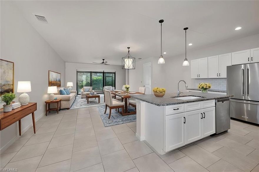 Welcome to this beautifully designed townhouse located in the highly sought-after gated community of Hamilton Place. Offering 3 bedrooms and 2.5 bathrooms, this residence is perfect for those seeking both comfort and style. The main living area boasts elegant tile flooring, while the bedrooms feature modern vinyl flooring, creating a seamless flow throughout. The heart of the home is the spacious kitchen, complete with a large island, granite countertops, and stainless-steel appliances—ideal for both casual dining and entertaining. Impact windows and doors throughout provide added security and peace of mind. Enjoy Florida’s sunshine from your southern-facing screened-in lanai, perfect for outdoor relaxation. Additional features include a one-car attached garage with durable epoxy flooring, offering both functionality and style. Make this Hamilton Place townhouse your new home and experience the perfect fusion of luxury, convenience, and style.